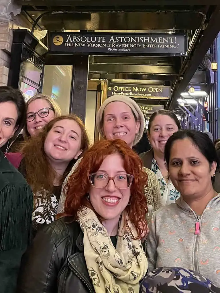 The Unchained team poses outside the "Harry Potter and the Cursed Child" marquee at the Lyric Theatre.